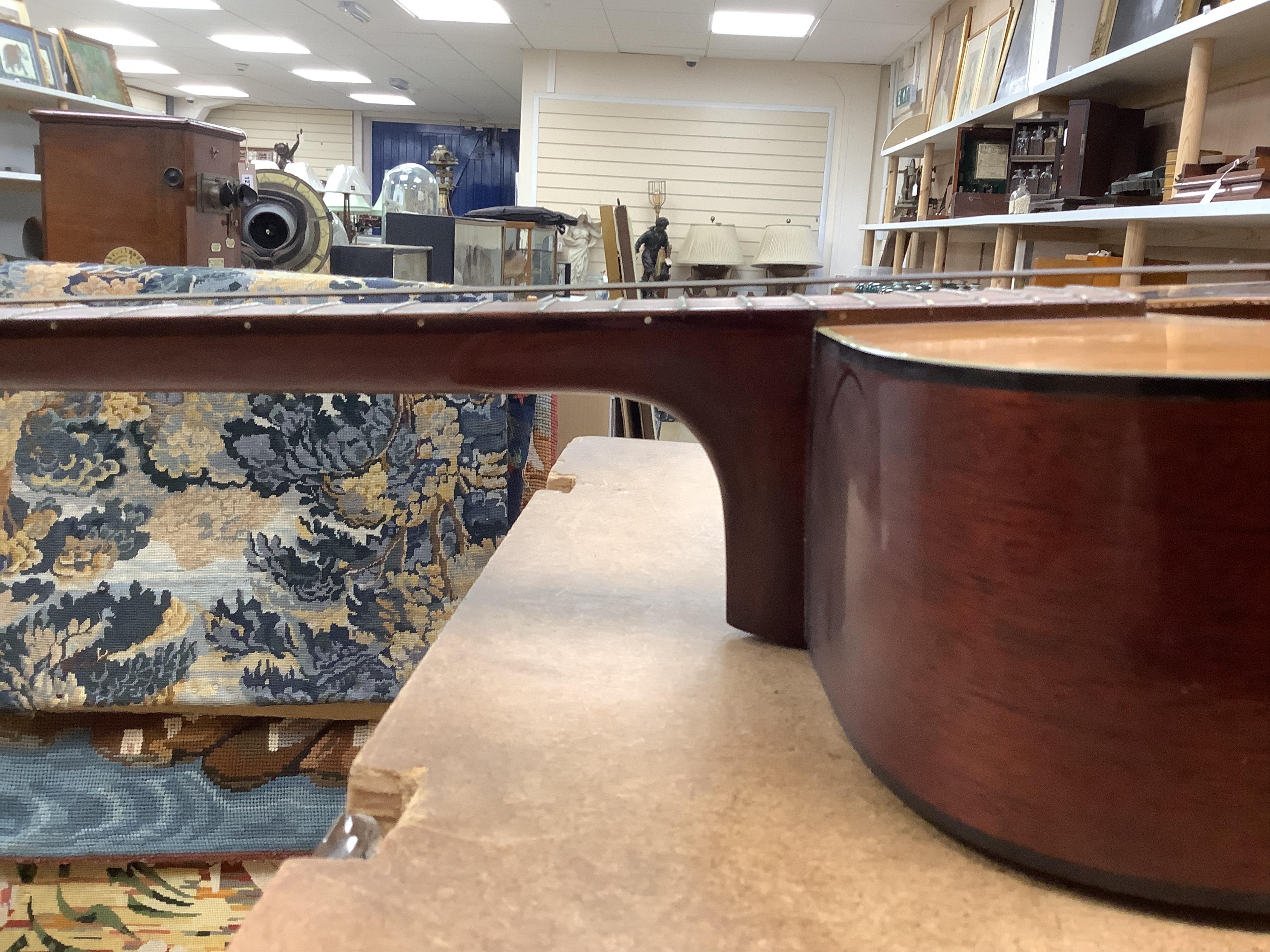 A Yamaha FG-180 acoustic steel string guitar